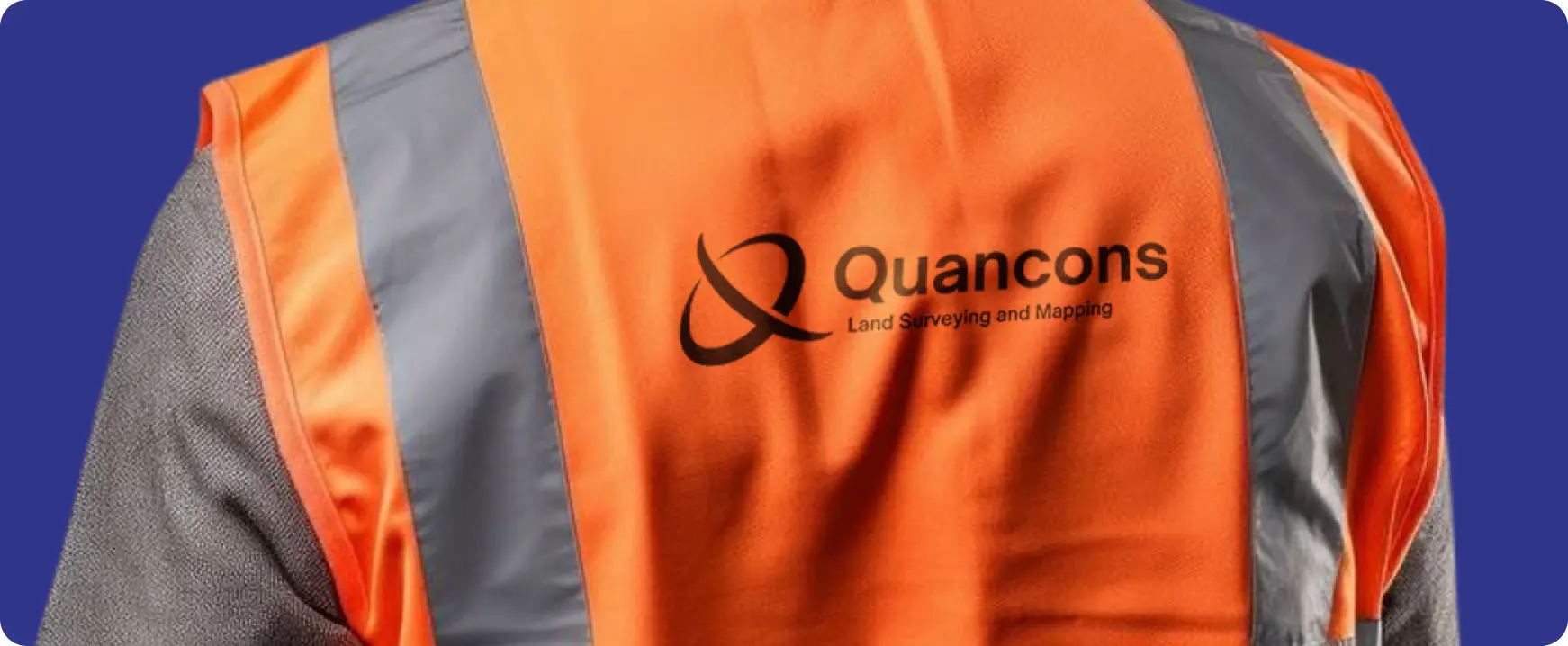 Quancons logo printed on a high-visibility safety vest